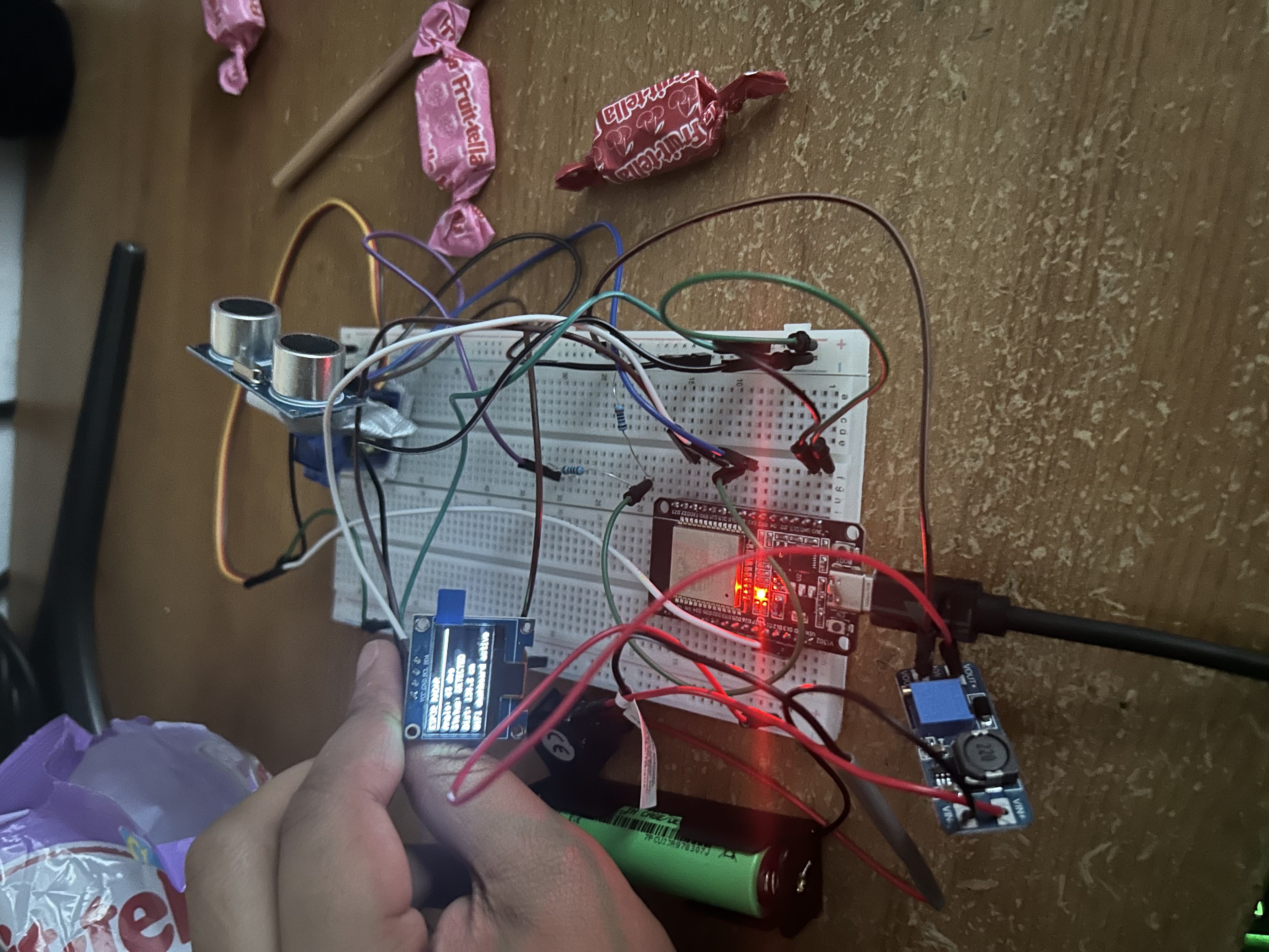Real I2C OLED displaying distance and scan readings on the radar scanner