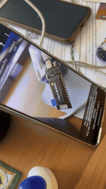 Claude Code flashing an ESP32 and fixing its on-screen UI, verified live through the camera