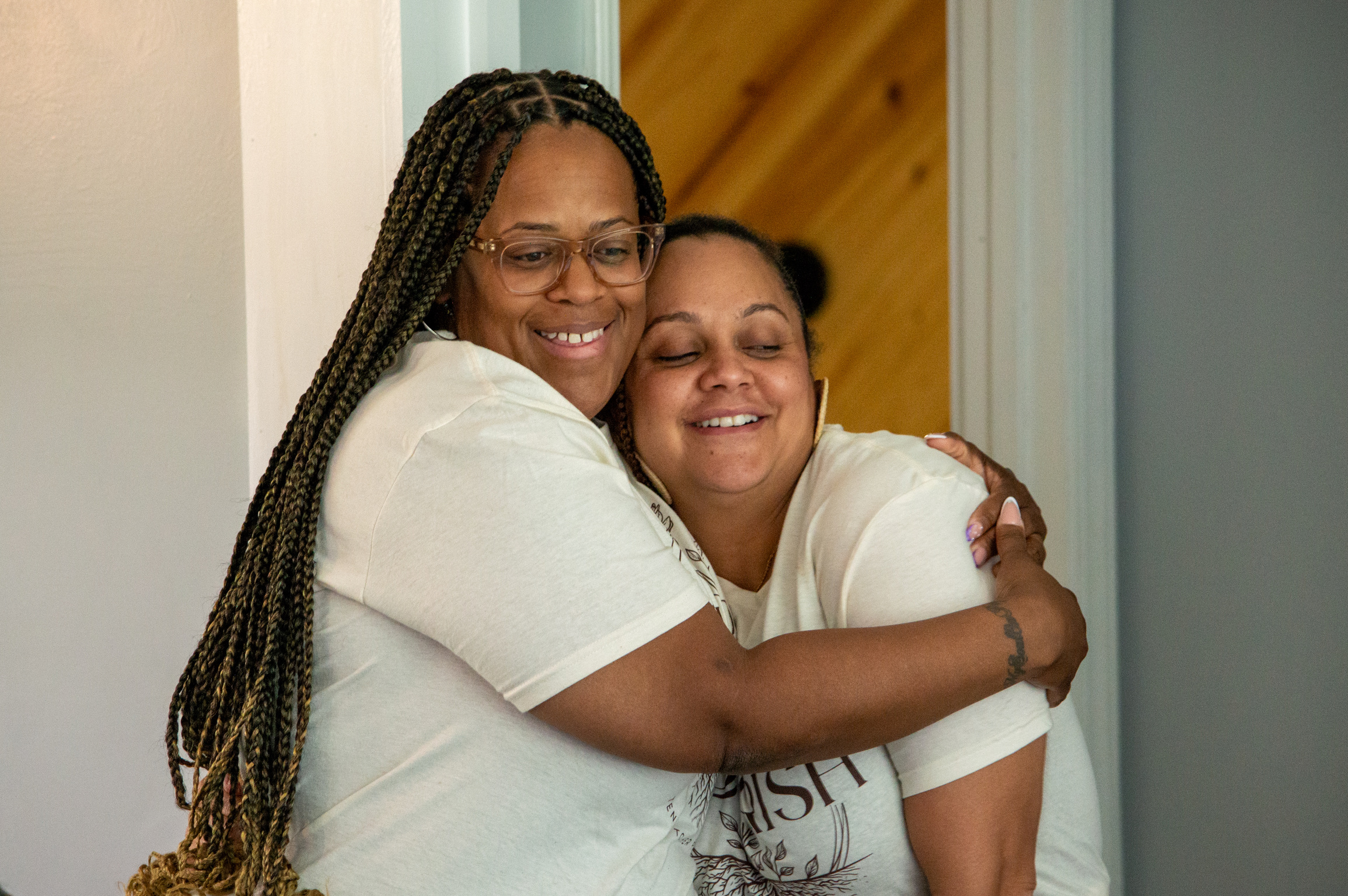 Two women sharing a warm embrace