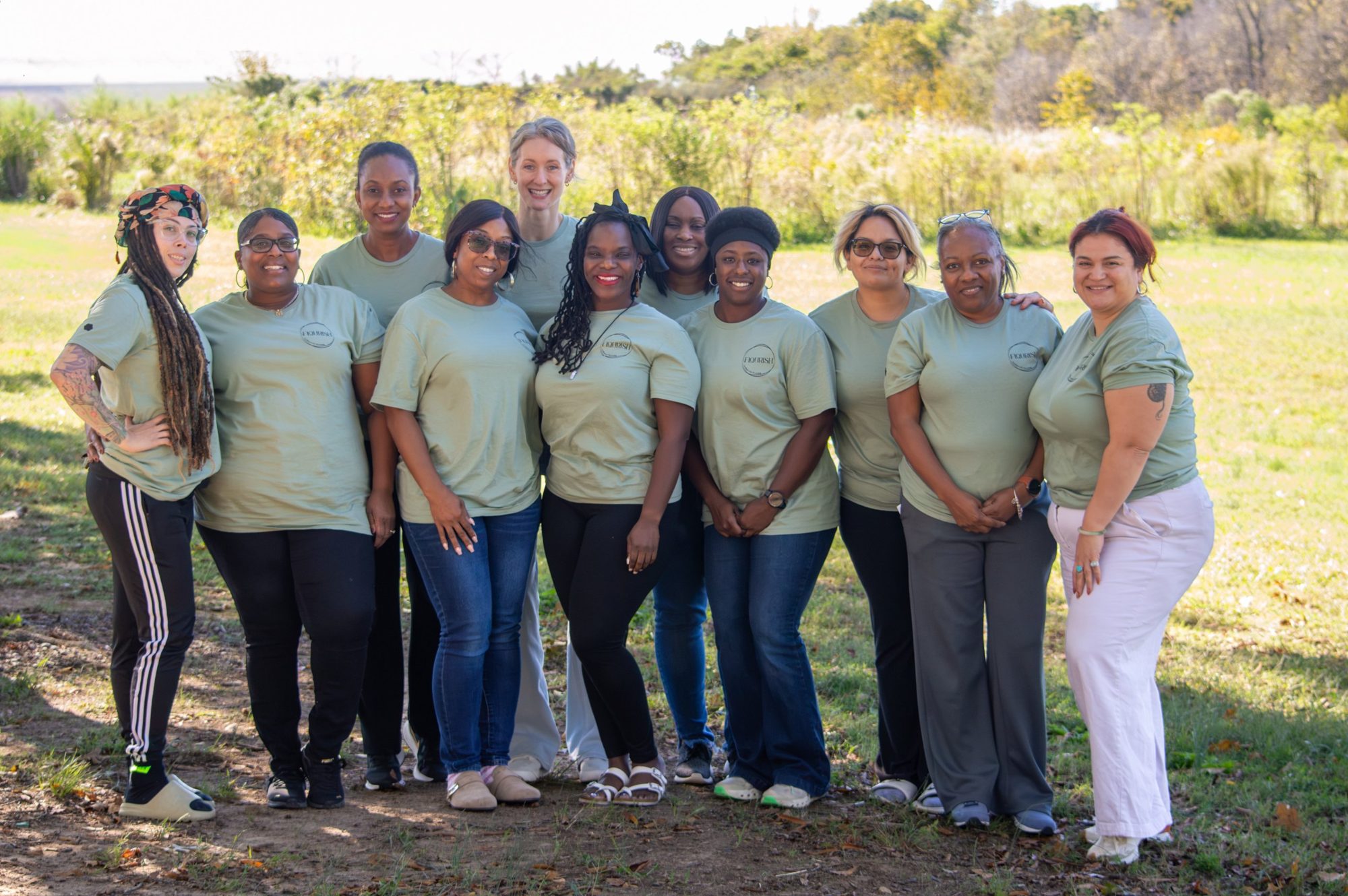 Retreat guests together in matching Flourish shirts