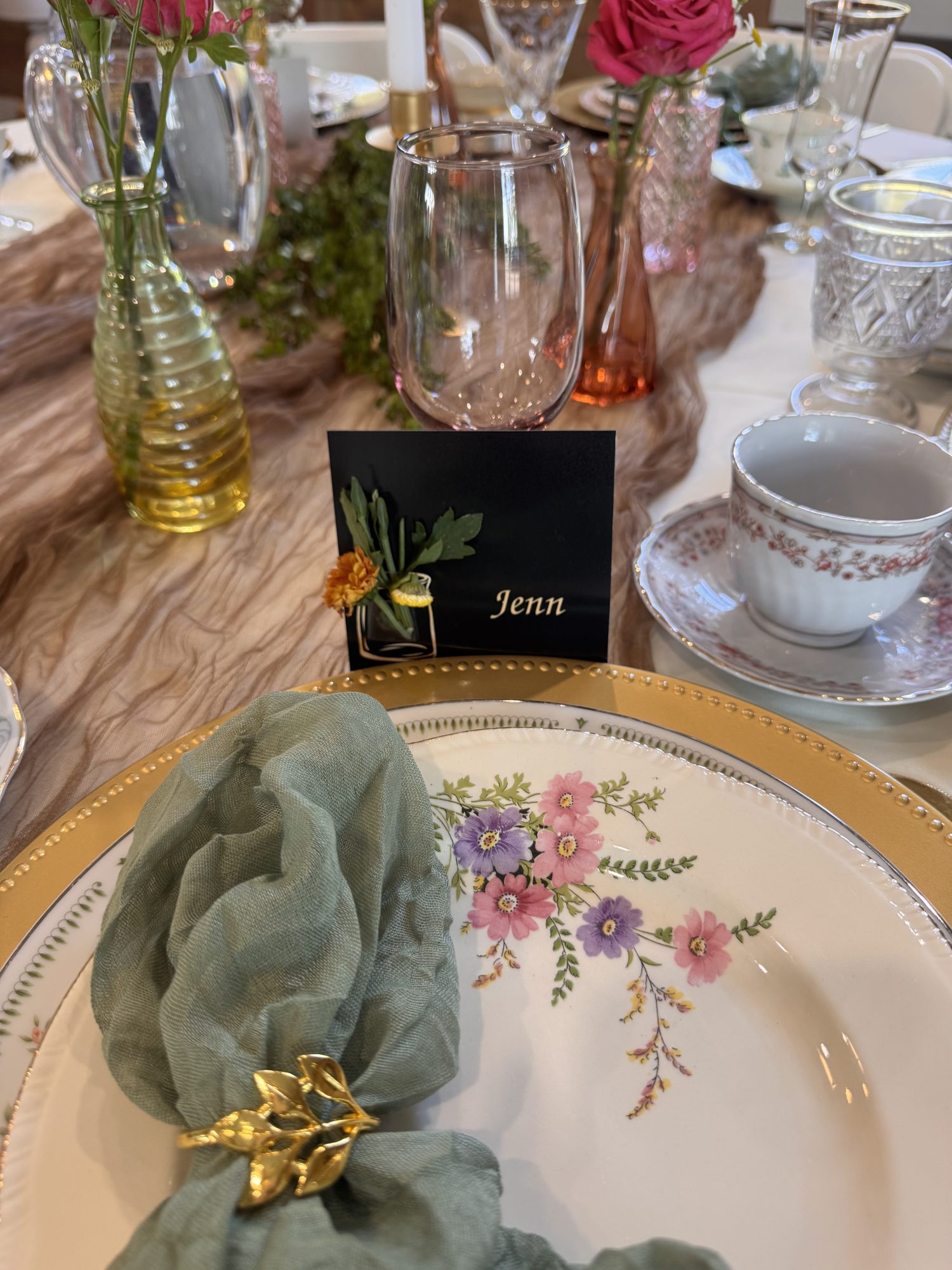 A place setting with a handwritten name card for Jenn