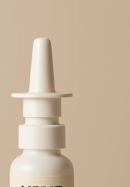 Amber pharmaceutical nasal spray bottle with white nasal applicator