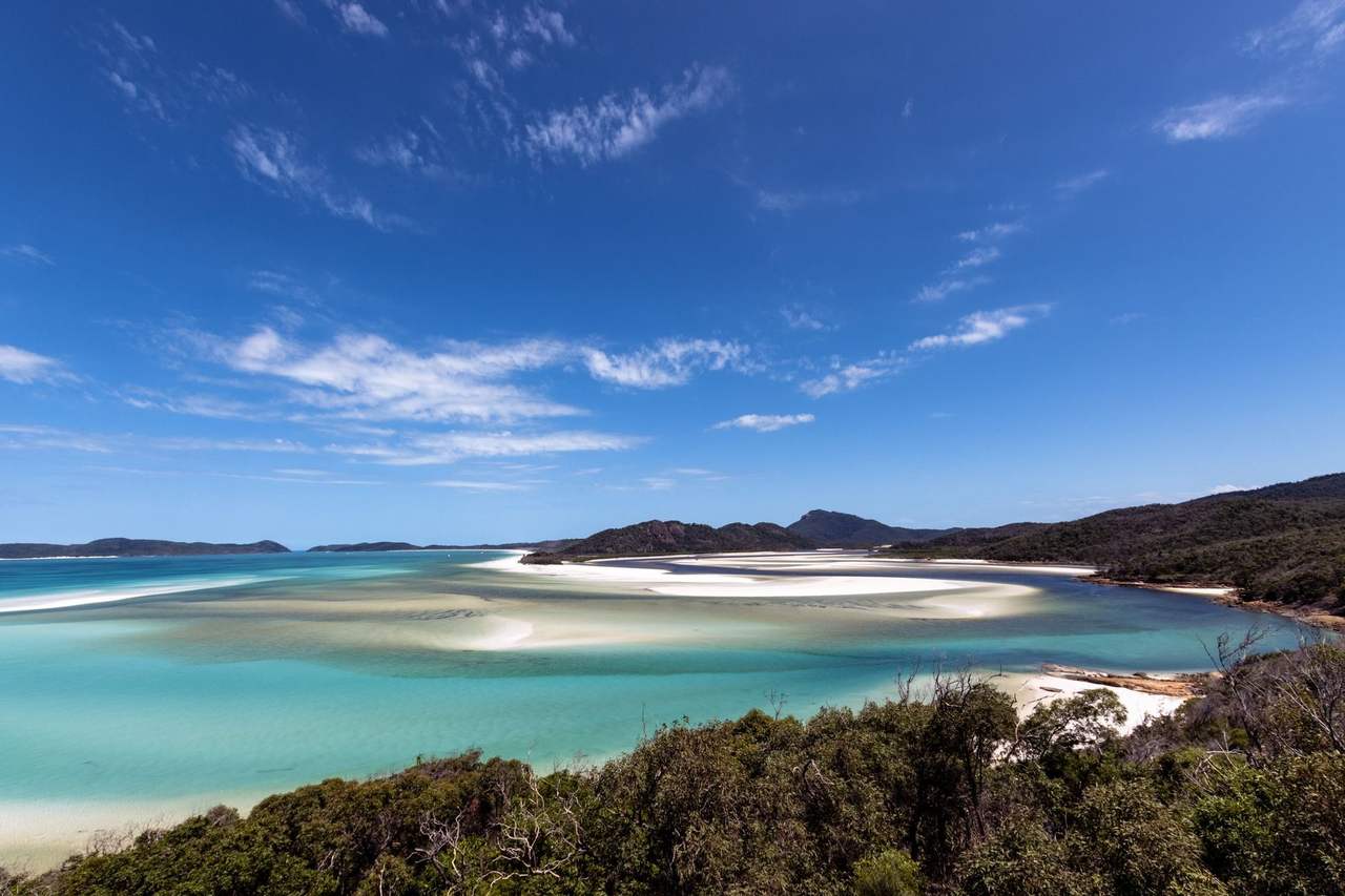Whitehaven Beach / Hill Inlet swirling sandbars, Whitsundays (Airlie Beach port), day, blue sky