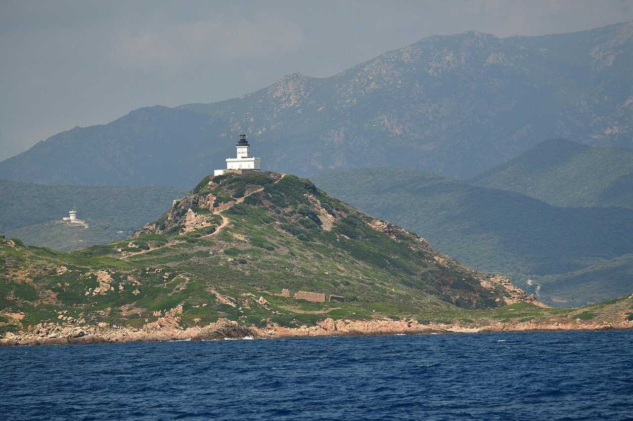 Sanguinaires Islands lighthouse off Ajaccio, Corsica, day, pale blue sky