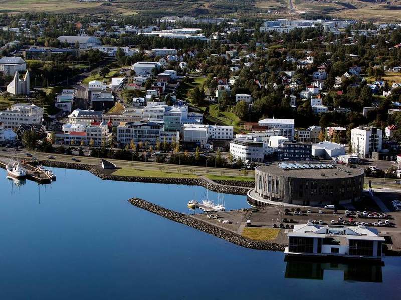 Panoramic view of Akureyri with snowcapped mountains