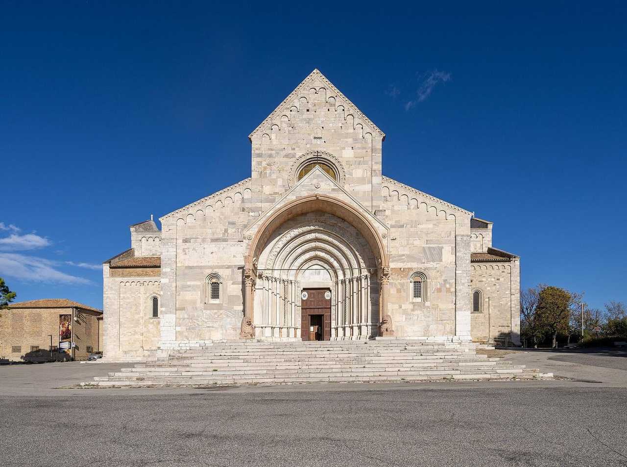 Duomo di San Ciriaco facade and lions, Ancona, day, solid blue sky