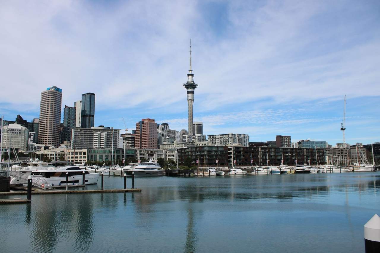 Auckland Sky Tower and Viaduct Harbour marina, day, blue sky