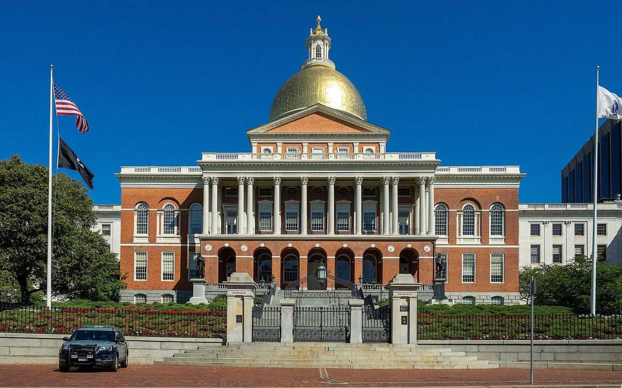 Massachusetts State House gold dome, day, blue sky