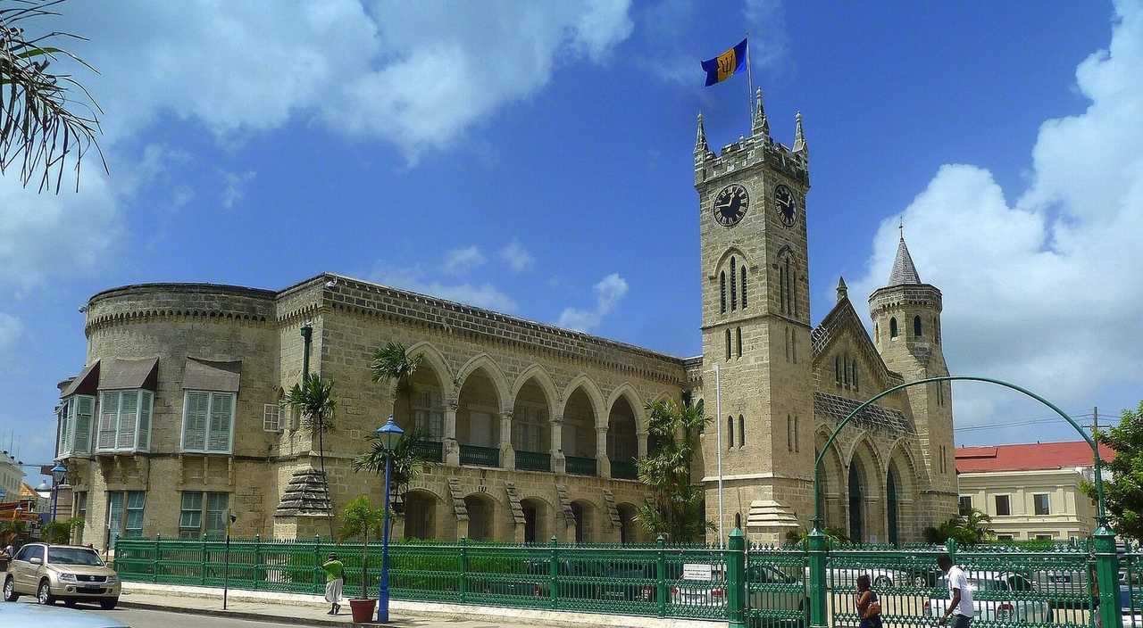 Barbados Parliament Buildings and clock tower, Bridgetown, day, blue sky with clouds