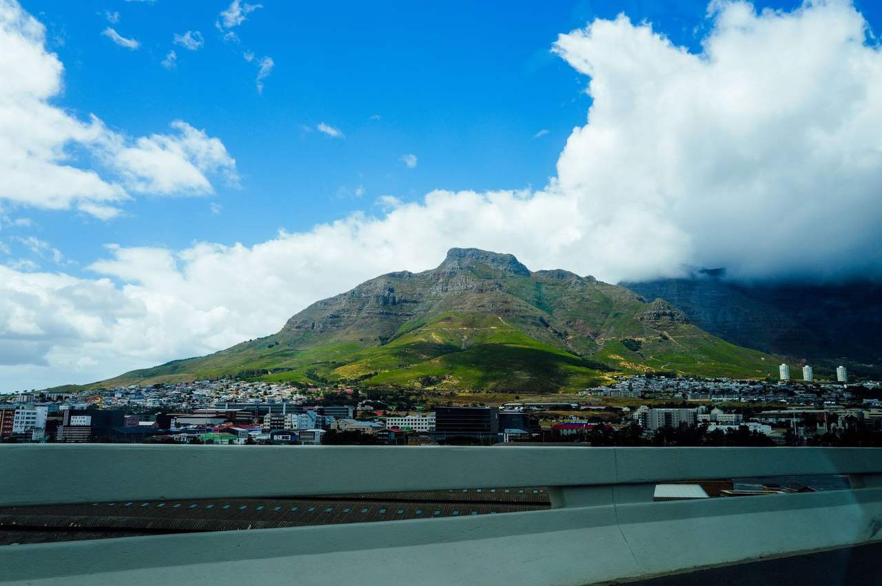 Table Mountain over Cape Town with tablecloth cloud, day, vibrant blue sky