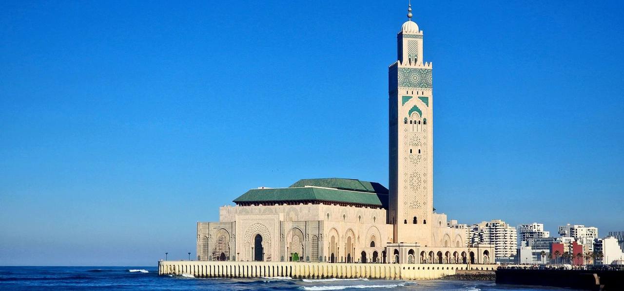 Hassan II Mosque on the Atlantic, Casablanca, day, vibrant blue sky