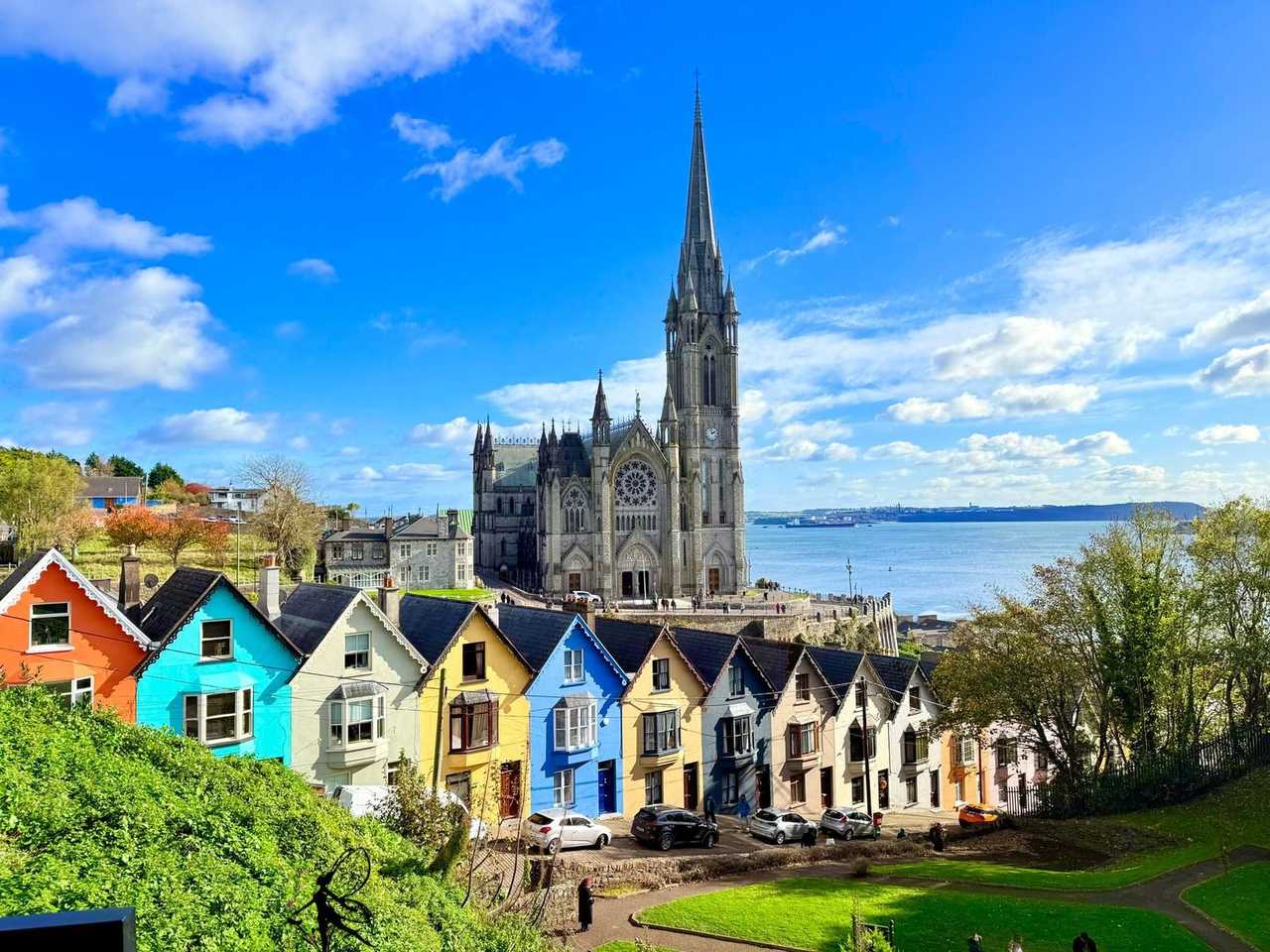 Cork Deck of Cards colourful terraces and St Colman's Cathedral, day, blue sky