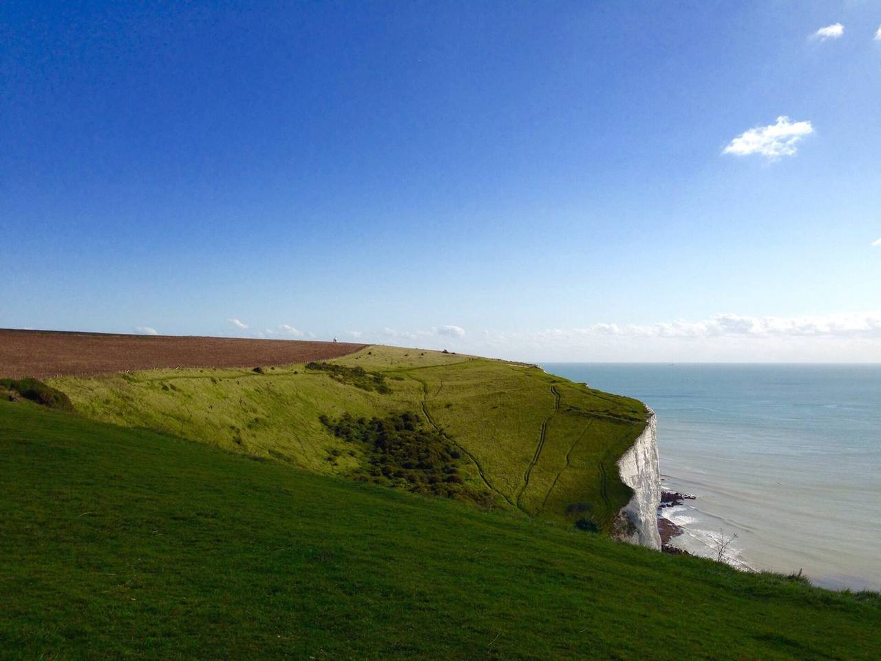 White Cliffs of Dover chalk headland and sea, day, blue sky