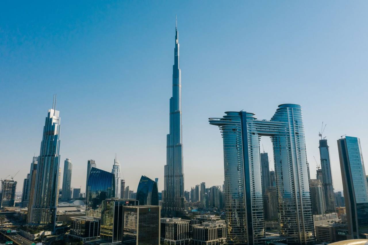 Dubai skyline with Burj Khalifa, day, solid blue sky