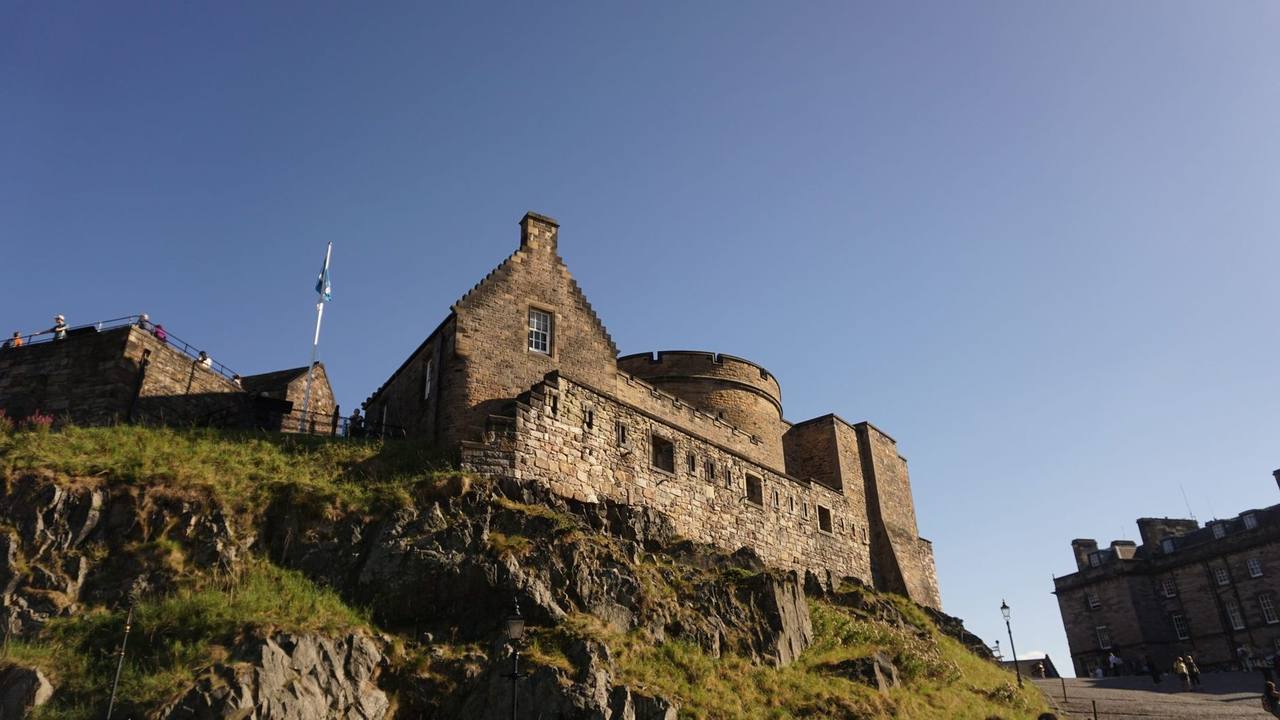 Edinburgh Castle on Castle Rock, day, solid blue sky