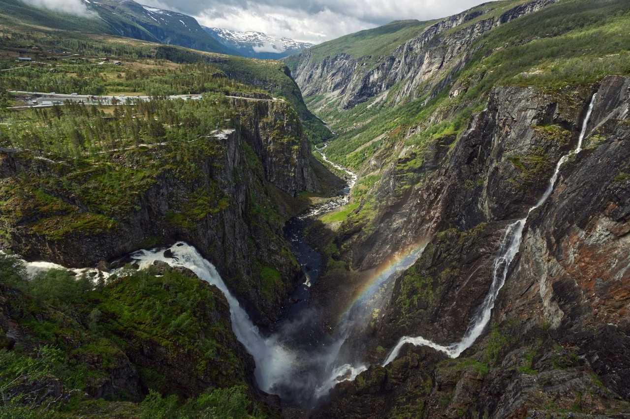Voringsfossen waterfall with rainbow, Eidfjord area, day, some blue sky