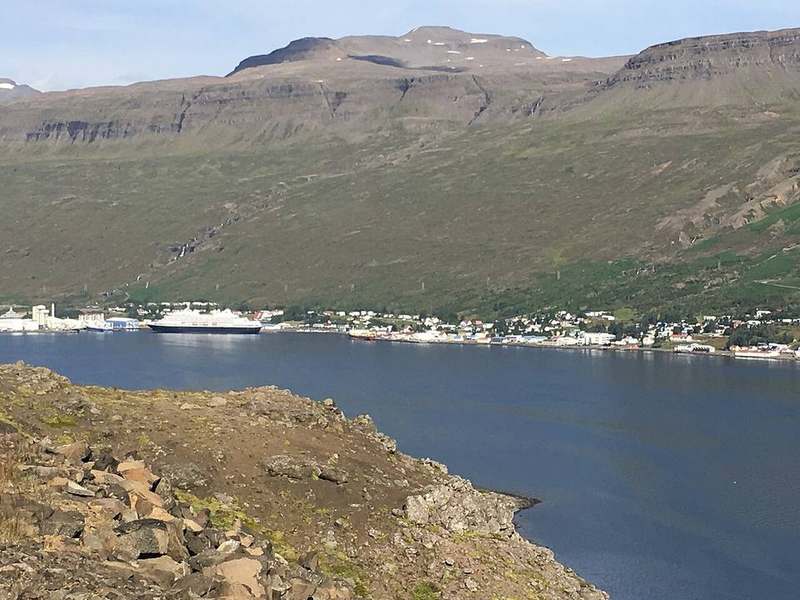 Eskifjörður harbour and colourful houses under Eastfjords mountains