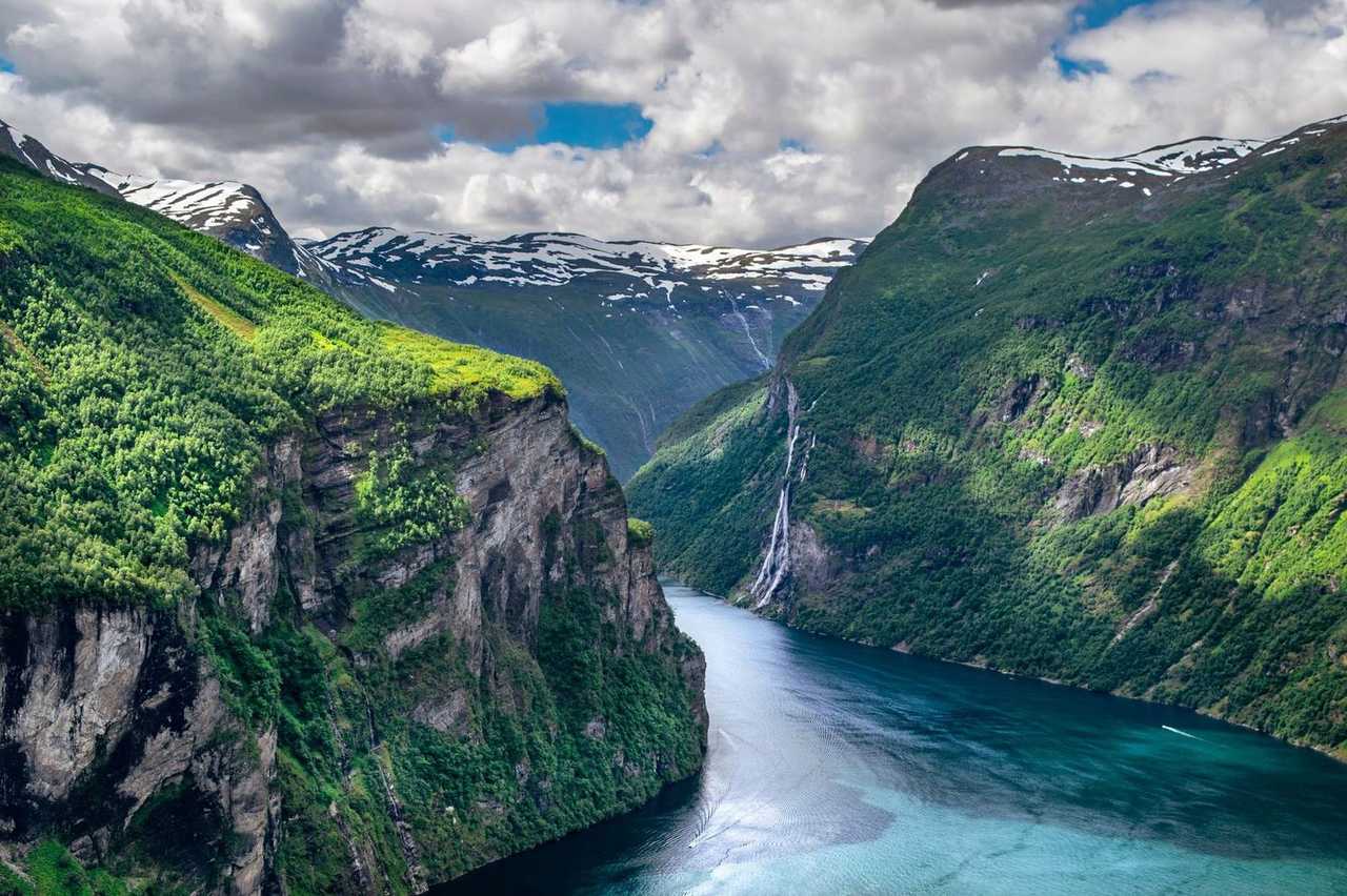 Geirangerfjord with waterfall, day, blue sky