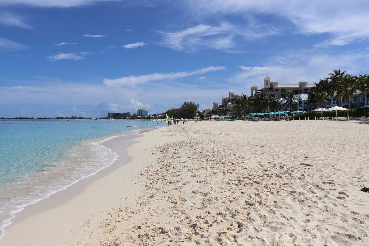 Seven Mile Beach, Grand Cayman, white sand and turquoise water, day, blue sky