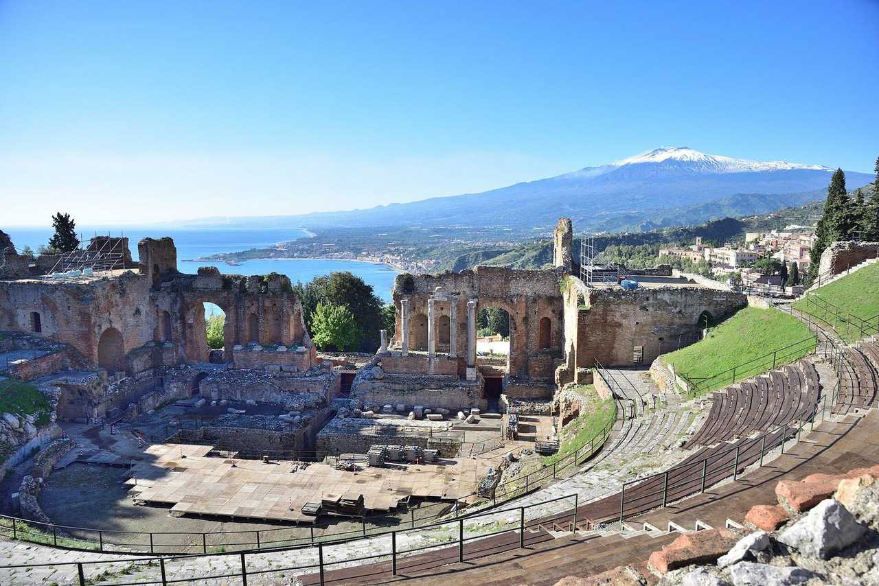 Teatro Greco Taormina with Ionian Sea and snow-capped Etna, day, blue sky