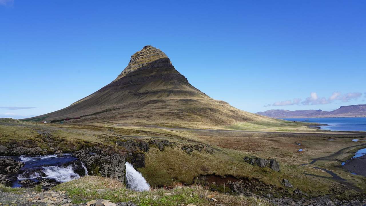 Kirkjufell and Kirkjufellsfoss, Grundarfjörður, day, clear blue sky