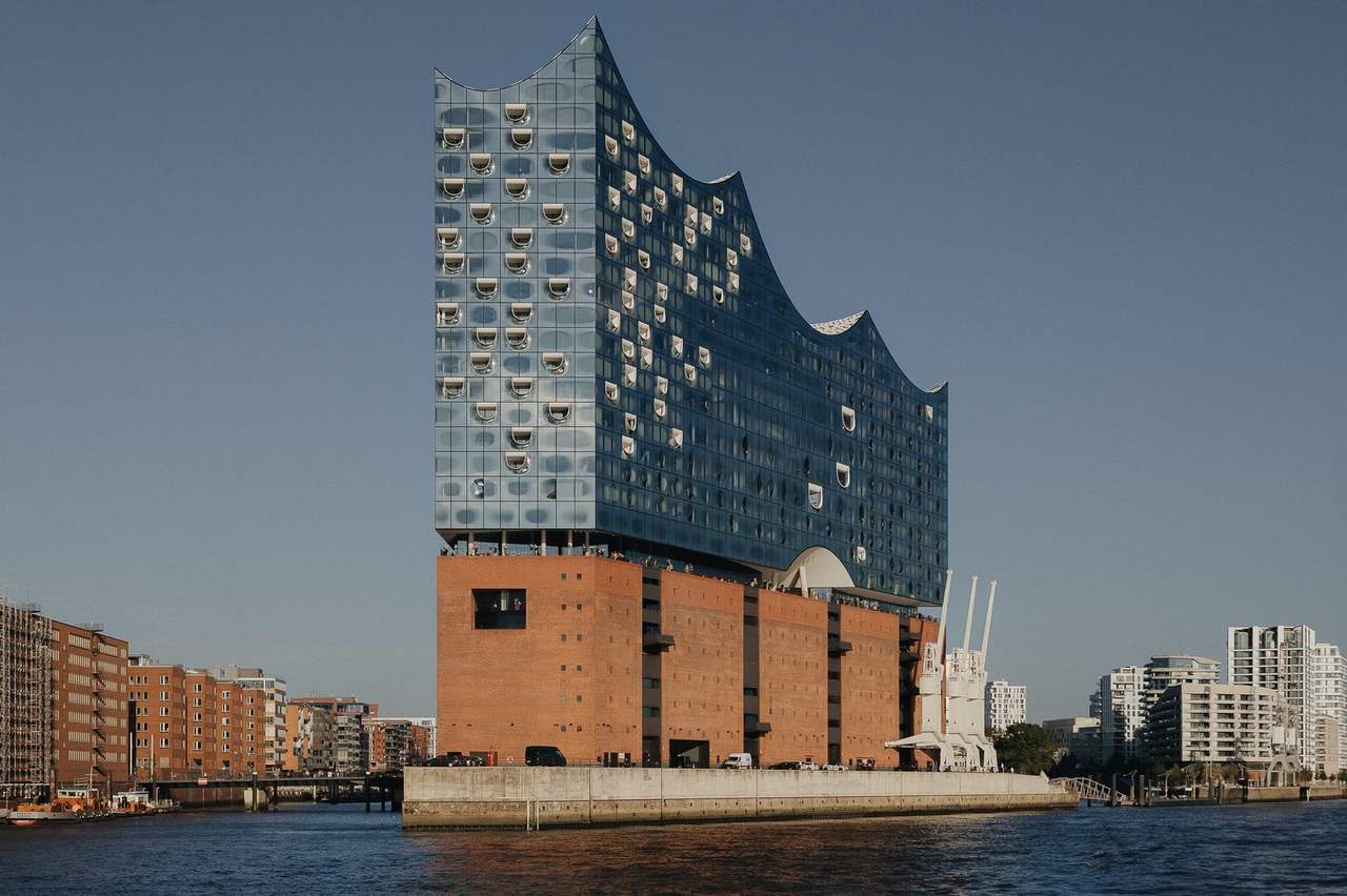 Elbphilharmonie on Kaispeicher A from the water, day, pale blue sky