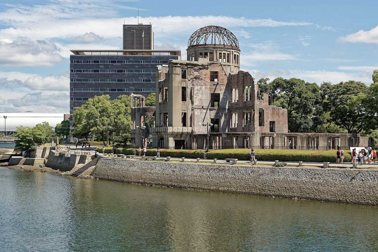 Hiroshima Peace Memorial (Genbaku Dome) across Motoyasu River, day, blue sky with white clouds
