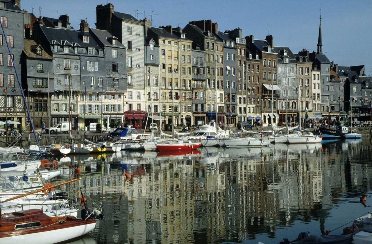 Honfleur Vieux Bassin colourful quayside, day, blue sky