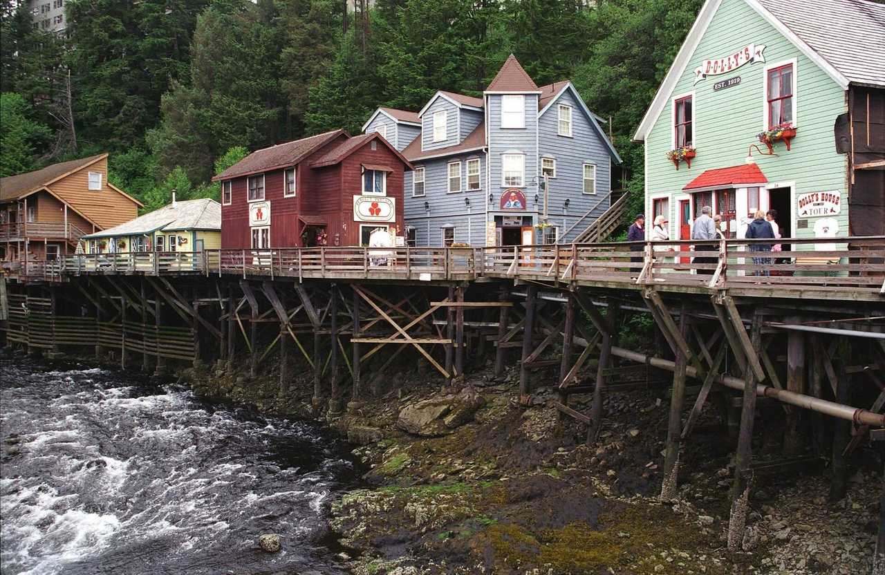 TRADEMARK: Creek Street on pilings over Ketchikan Creek, Dolly's House visible