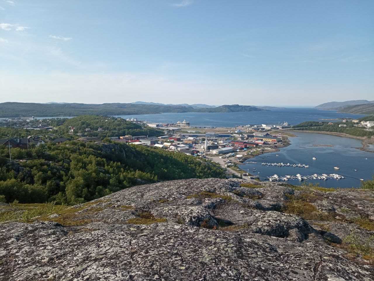 Kirkenes town from a mountain, day, pale blue sky