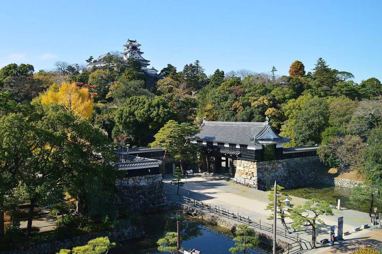Kochi Castle tenshu above Otemon gate and moat, day, solid blue sky