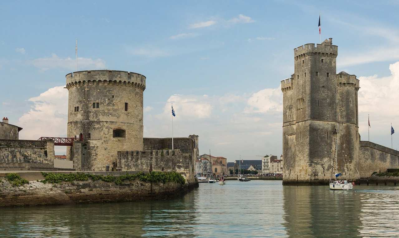 Tour de la Chaîne and Tour Saint-Nicolas, Old Port entrance, La Rochelle, day, blue sky