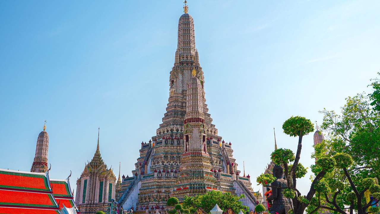 Wat Arun prang and satellite towers, Bangkok, day, clear blue sky