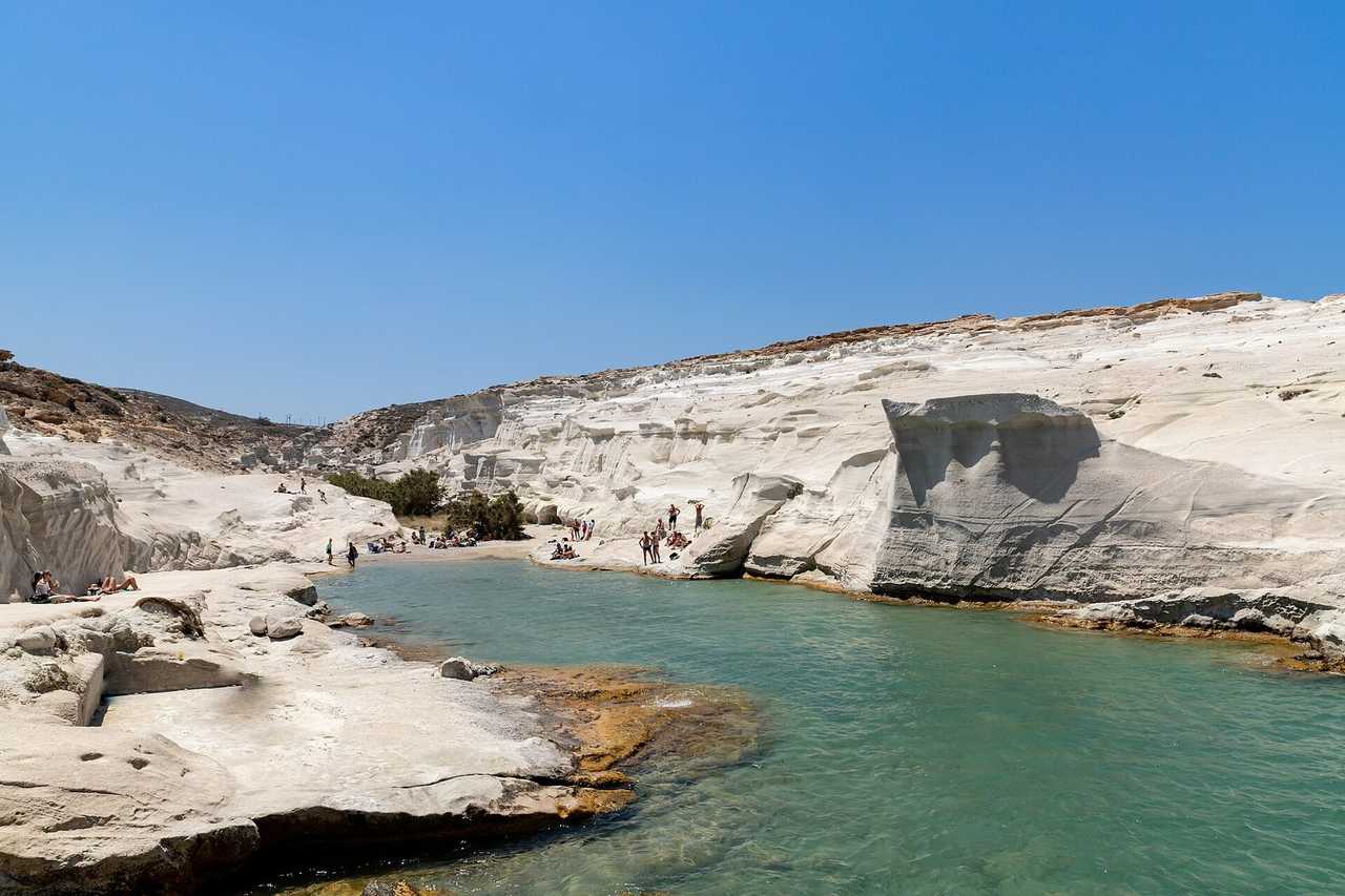 Sarakiniko white volcanic rock cove, Milos, day, solid blue sky
