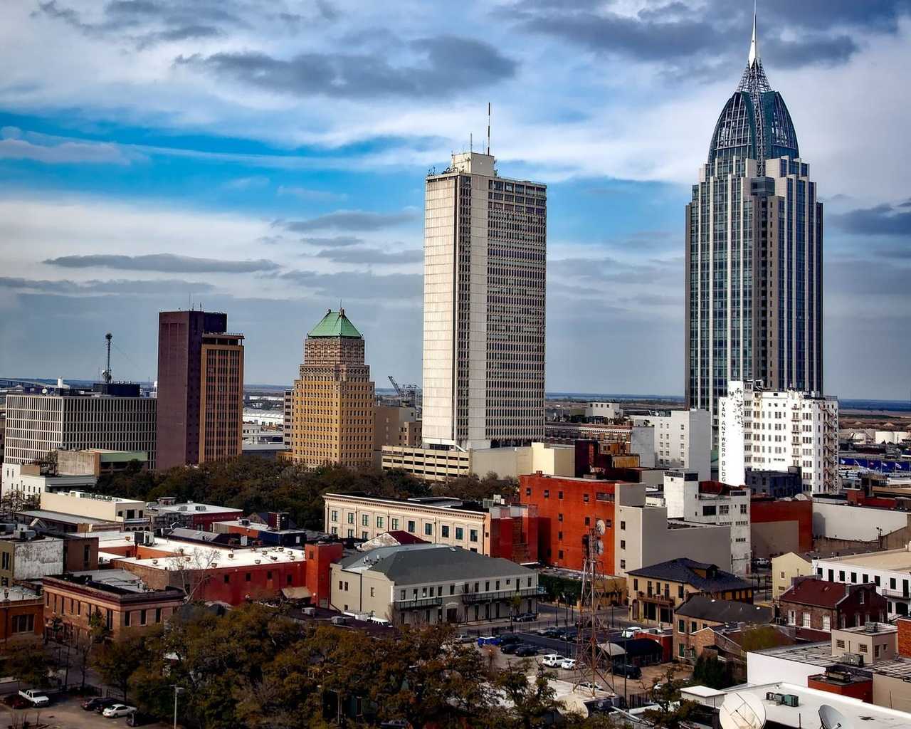 Mobile, Alabama downtown skyline including RSA Battle House Tower, day, blue sky