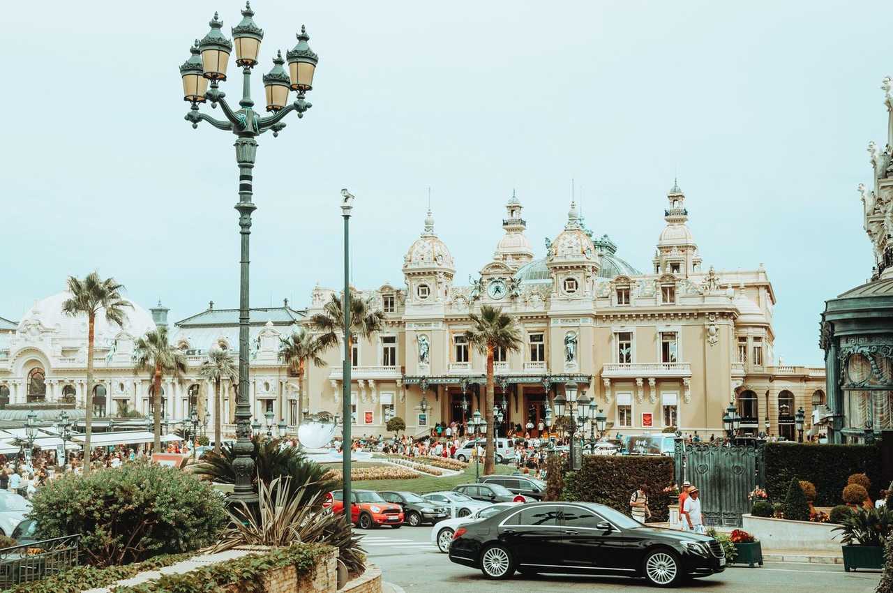 Casino de Monte-Carlo Place du Casino, day, pale blue sky, palm trees