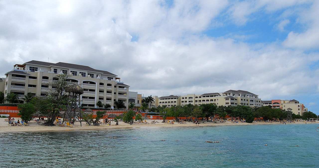 Iberostar Rose Hall Beach, Montego Bay — named resort beach buildings and bay, day, blue sky