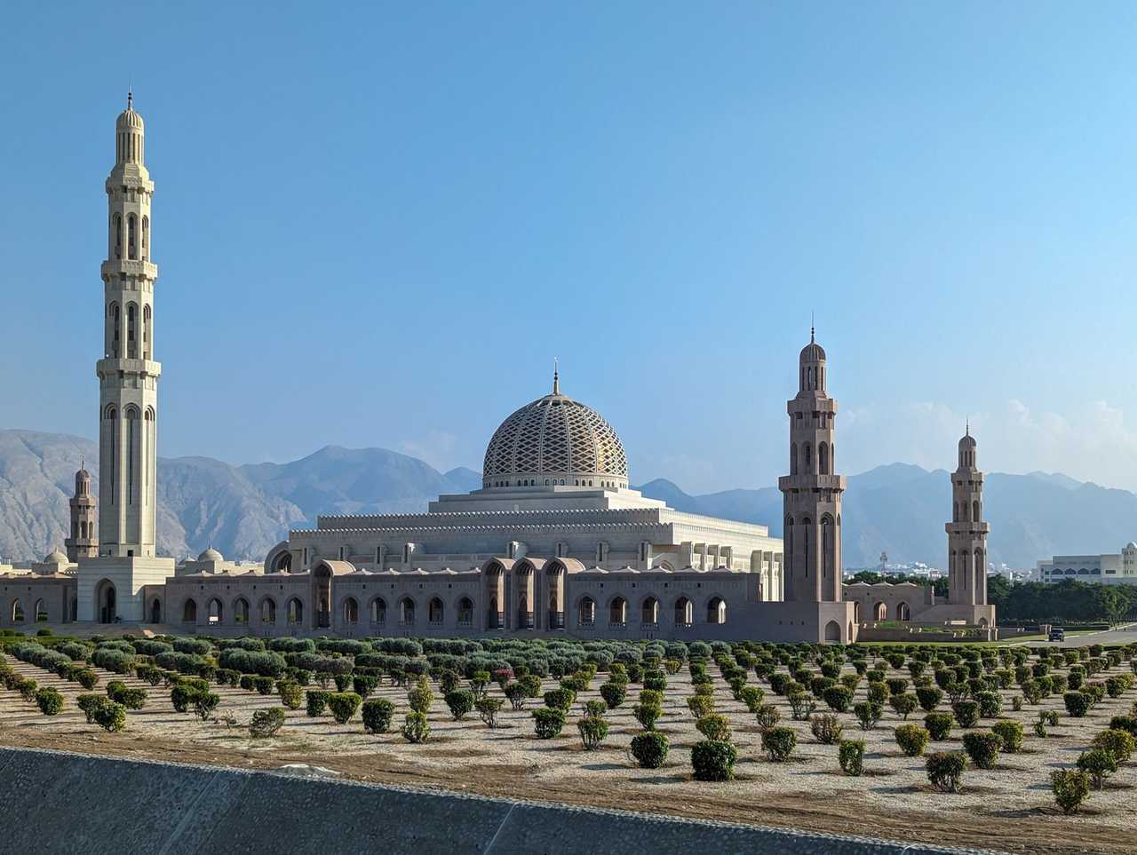 Sultan Qaboos Grand Mosque minarets and dome, Muscat, day, solid blue sky