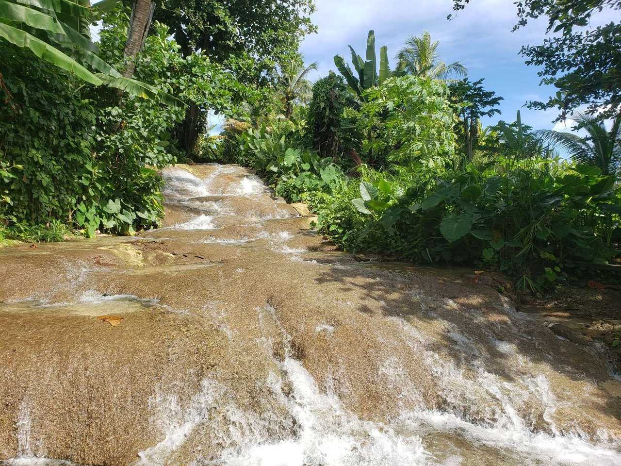 Terraced tropical waterfall (Dunn's River style), Ocho Rios call, day, blue sky visible