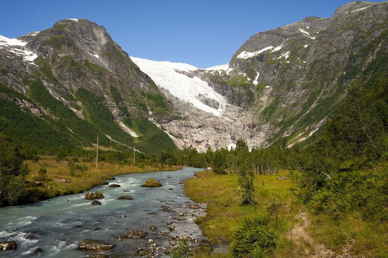 Briksdal-style glacier valley near Olden, day, solid blue sky