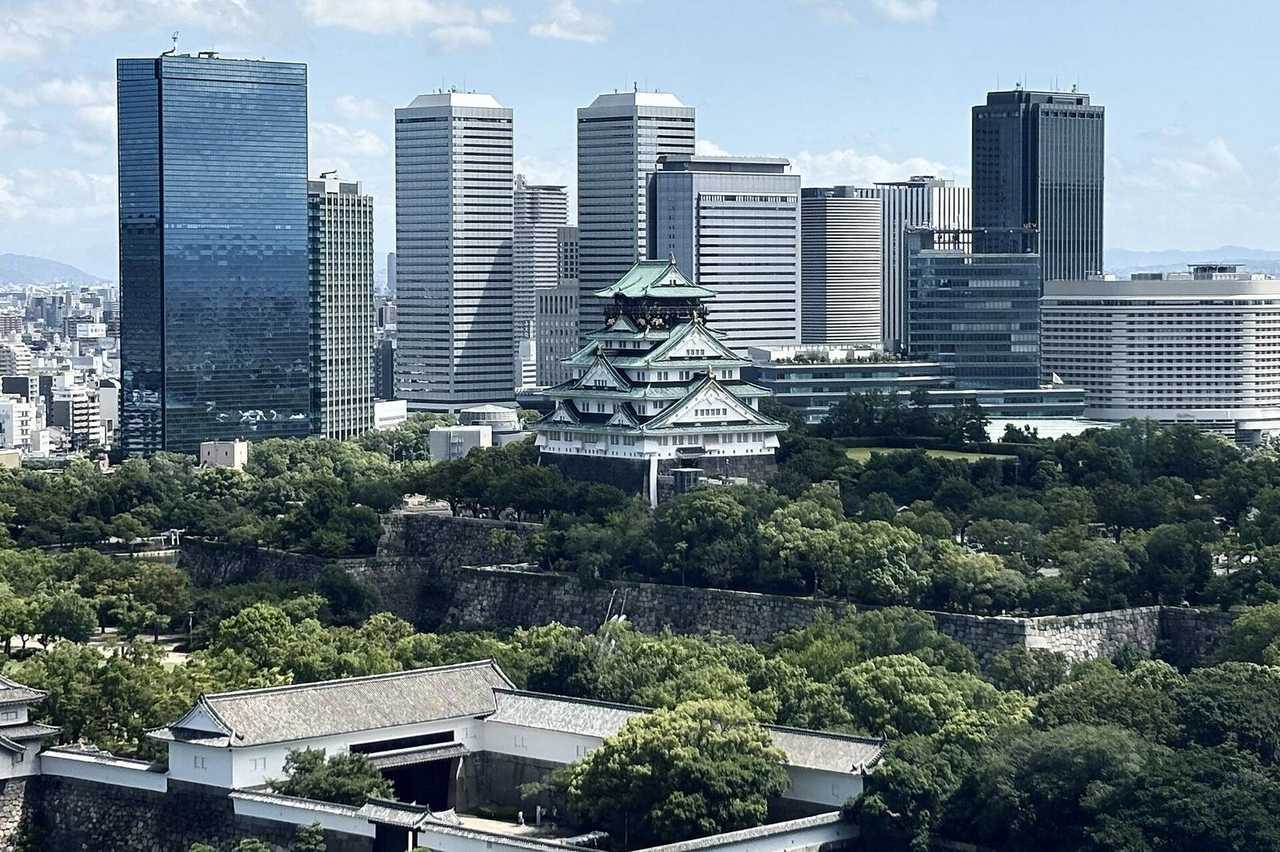 Osaka Castle keep with modern OBP skyline behind, day, blue sky