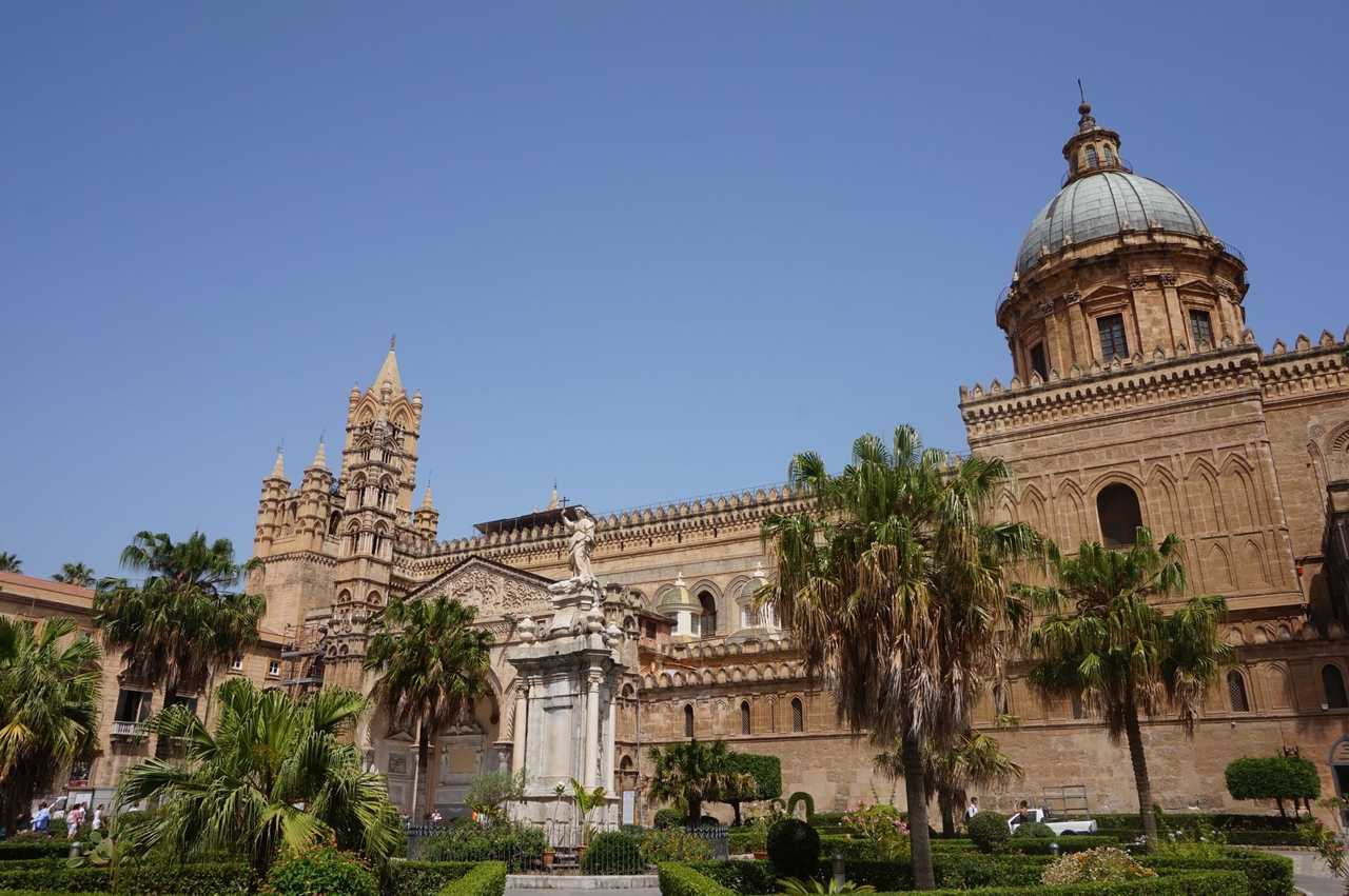 Palermo Cathedral and palm gardens, day, solid blue sky