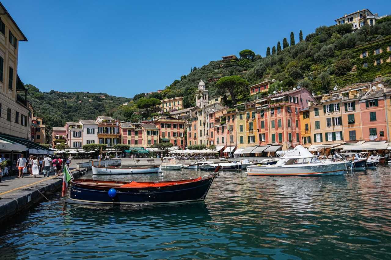 Portofino colourful harbour village, day, solid blue sky