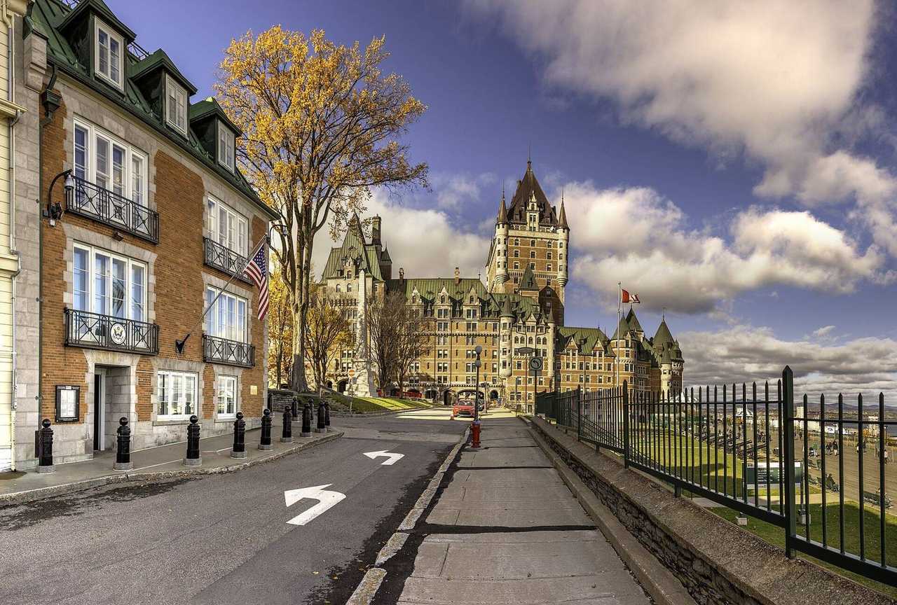 Château Frontenac from Old Quebec street, day, blue sky with white clouds