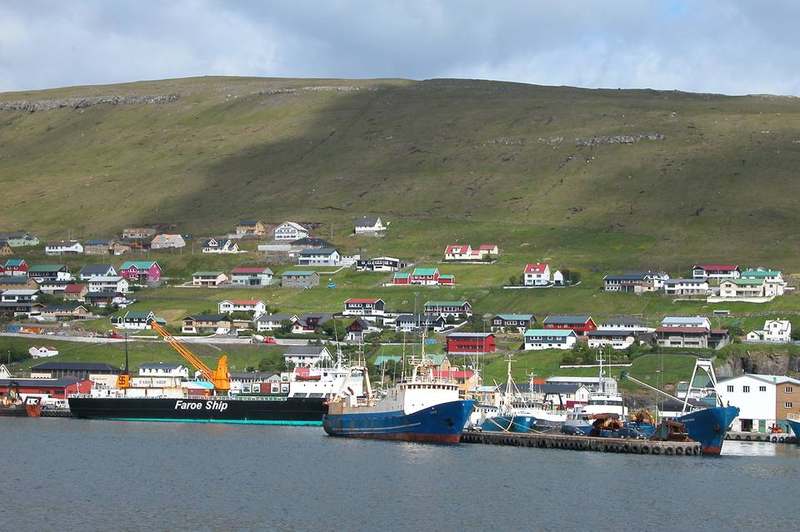 Fjord harbour and green hills along Eysturoy's east shore at Runavík