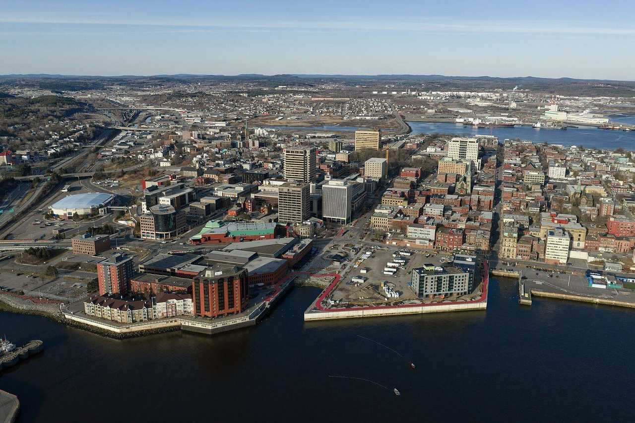 Uptown Saint John NB waterfront aerial with harbour and downtown, day, clear blue sky