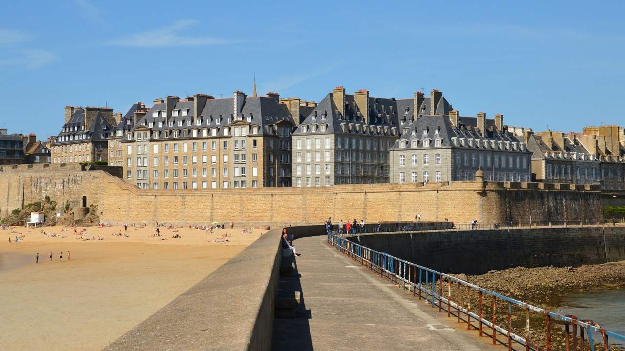 Saint-Malo intra-muros ramparts and beach, day, solid blue sky