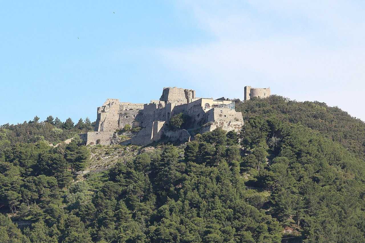 Arechi Castle on the wooded ridge above Salerno, day, pale blue sky