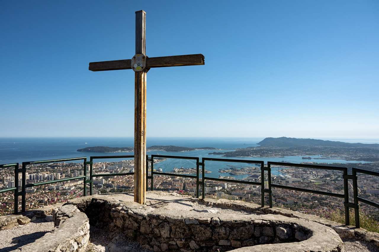 Mont Faron summit cross overlooking Toulon and the Mediterranean, day, solid blue sky