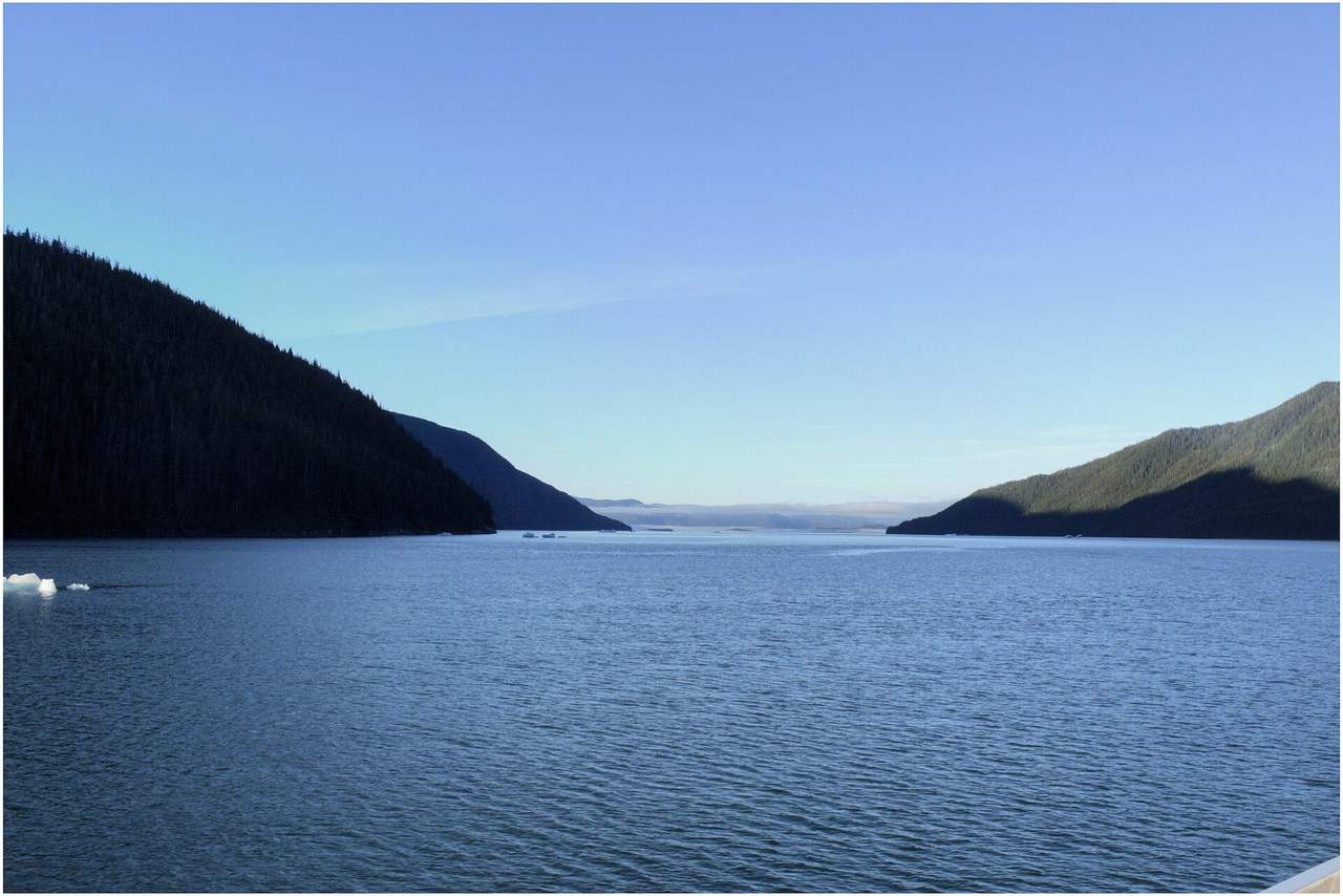 Tracy Arm ice fjord, Alaska, day, pale blue sky